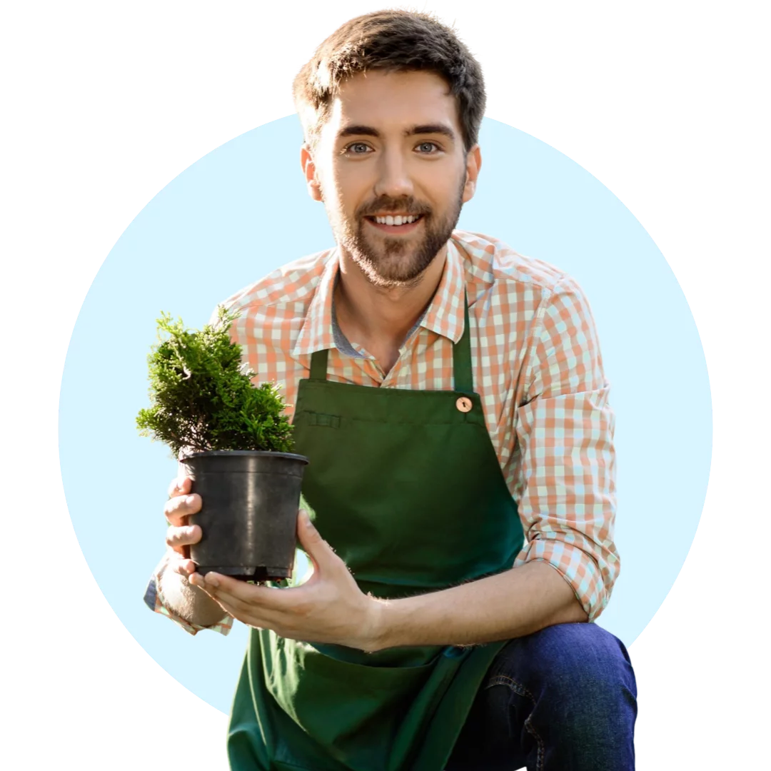 Gardener holding a potted plant